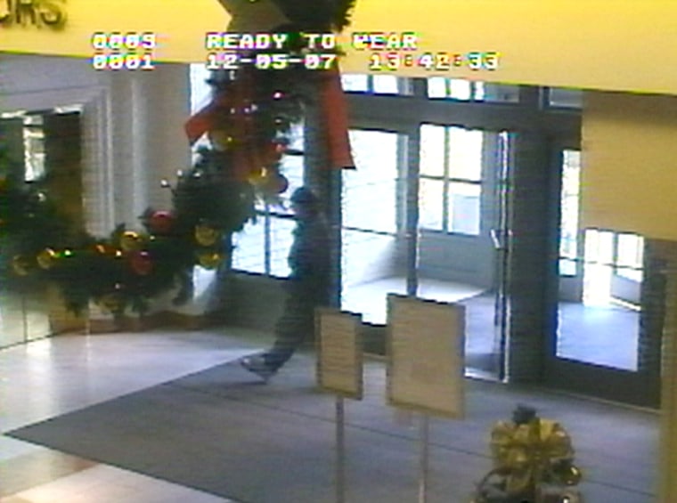 Image: image taken from a video surveillance camera and released by the Omaha Police Department Friday Dec. 7, 2007 shows gunman Robert A. Hawkins walking into the Westroads Mal