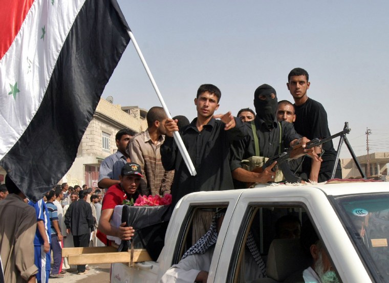 Members of the Shi'ite Mehdi army attend a funeral for their comrades in Kerbala