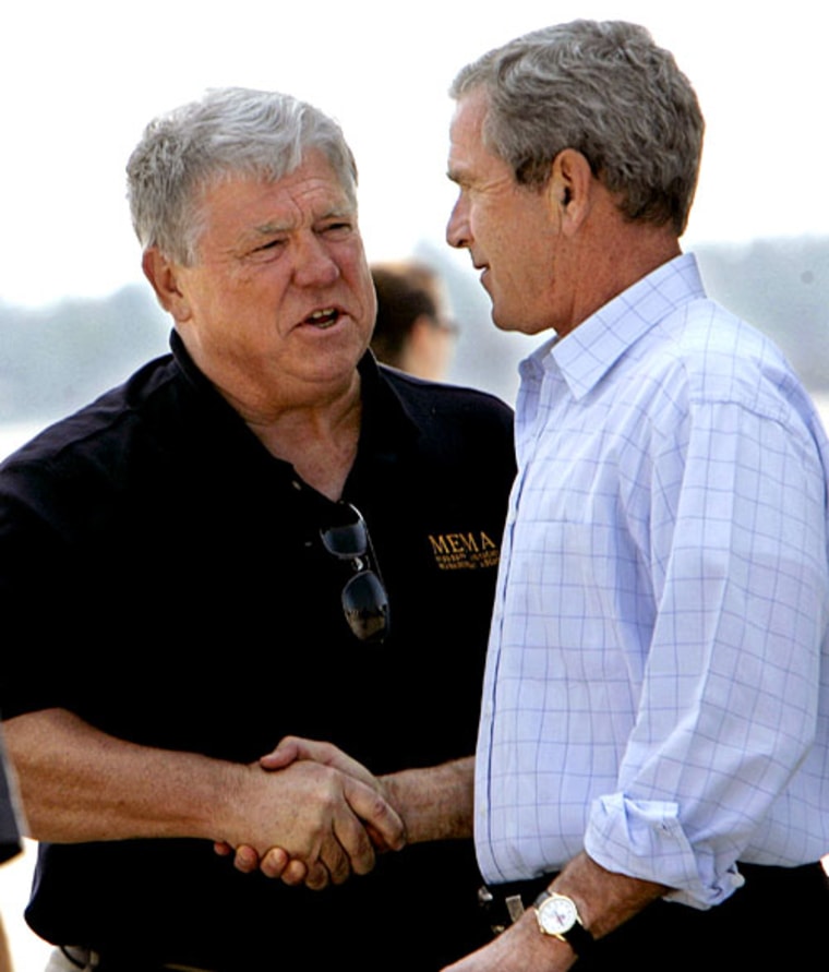 The president greets Mississippi Gov. Haley Barbour during a tour of damaged areas on Sept. 15