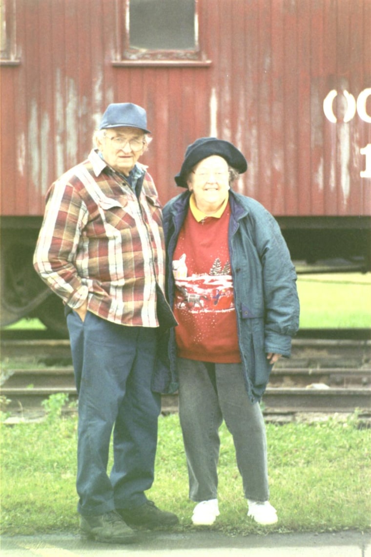 Bill and Betty standing at the old train station on their anniversity 5 years ago.