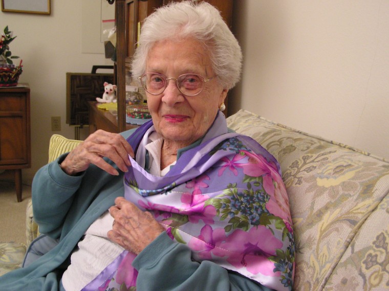 The picture was taken one year ago on her 97th birthday as she modeled her new scarf, one of her birthday presents.