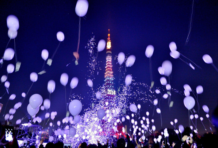 Image: People release balloons to celebrate the New Year
