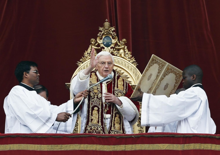 Image: Pope Benedict XVI blesses crowd as he makes "Urbi et Orbi" address from a balcony in St. Peter's Square in Vatican