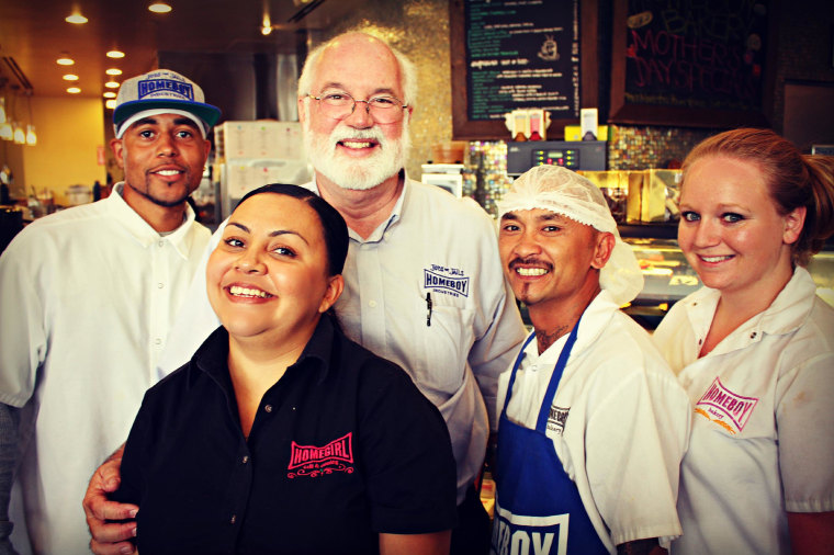 Father Greg Boyle and some of the many people his Los Angeles-based Homeboy Industries has helped through job and skills training.