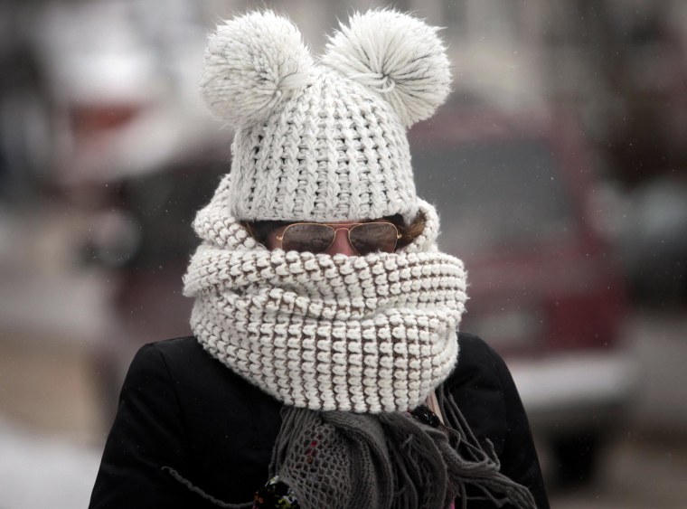 Image: Kristy Gruley of Madison, Wis. is well-bundled against the elements