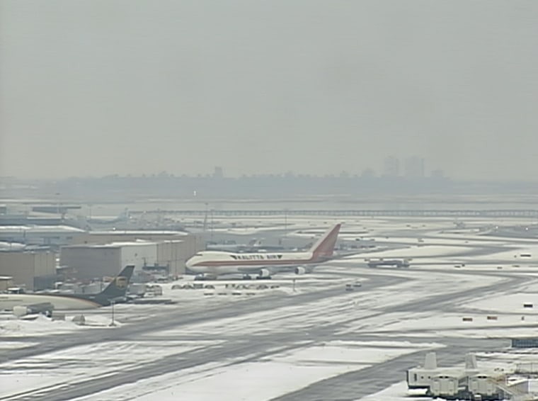 Freezing rain and icy runways led JFK International Airport in New York to temporarily shut down Sunday morning. A plane landing from Toronto skidded off the runway, the FAA said.