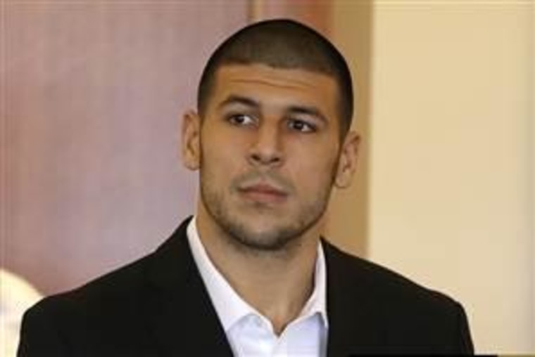 Image: Aaron Hernandez, formerly of the New England Patriots, stands during his arraignment in Fall River, Mass., on Sept. 6.