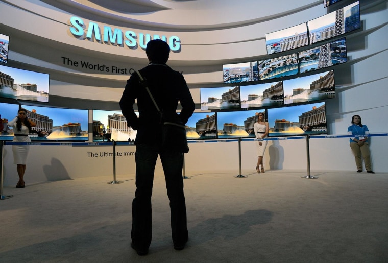 An attendee looks at the Samsung booth at the 2014 International CES at the Las Vegas Convention Center on January 7, 2014 in Las Vegas.