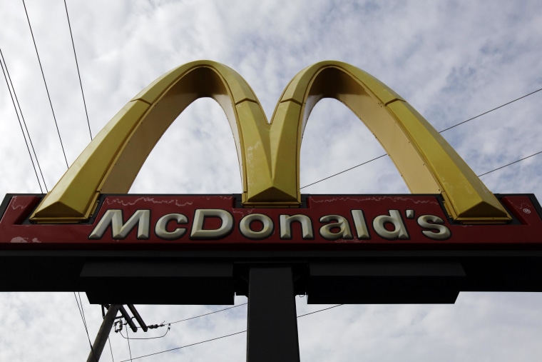The owner of seven franchised McDonald's restaurants is paying $500,000 to settle worker claims.