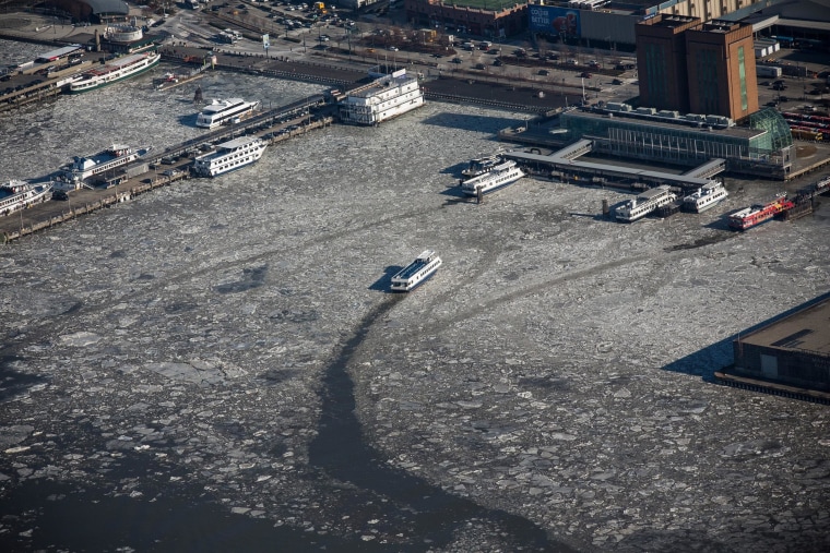 Image: A ferry makes its way through ice floes on the Hudson River