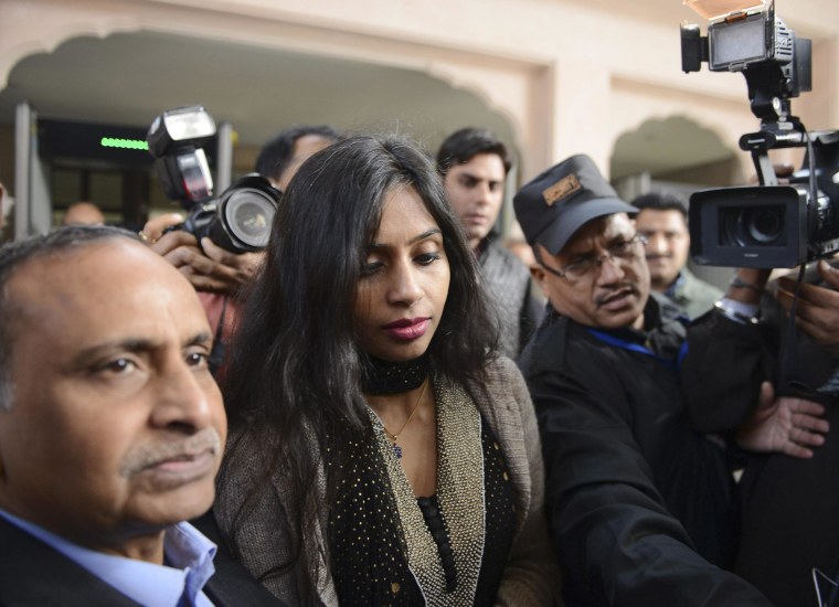 Image: Indian diplomat Khobragade leaves with her father to meet India's Foreign Minister Salman Khurshid in New Delhi