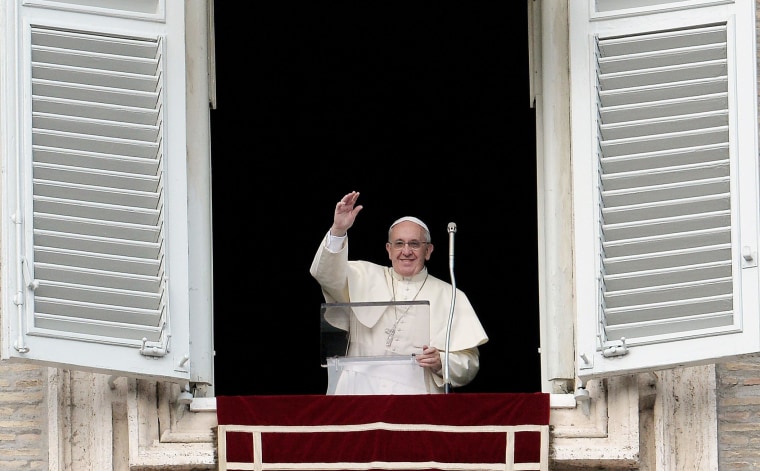Pope Francis waves to the faithful gathered in St.Peter's Square at the Vatican on Sunday.
