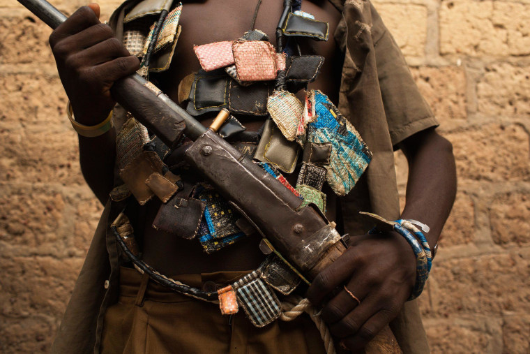 Image: An anti-balaka militiaman holds a gun on outskirts of Bangui, Central African Republic