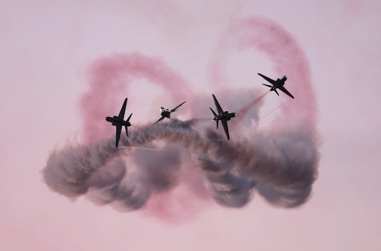 Image: The Saudi Hawks display team perform during the opening of the Bahrain International Airshow.