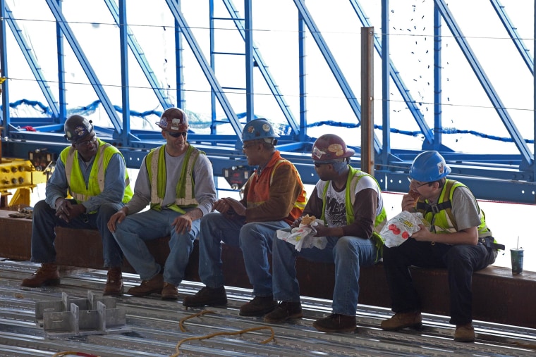 Construction workers take a lunch break in New York City. For most American workers, it lasts half an hour.