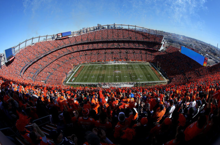 Image: The Denver Broncos kick off to the New England Patriots