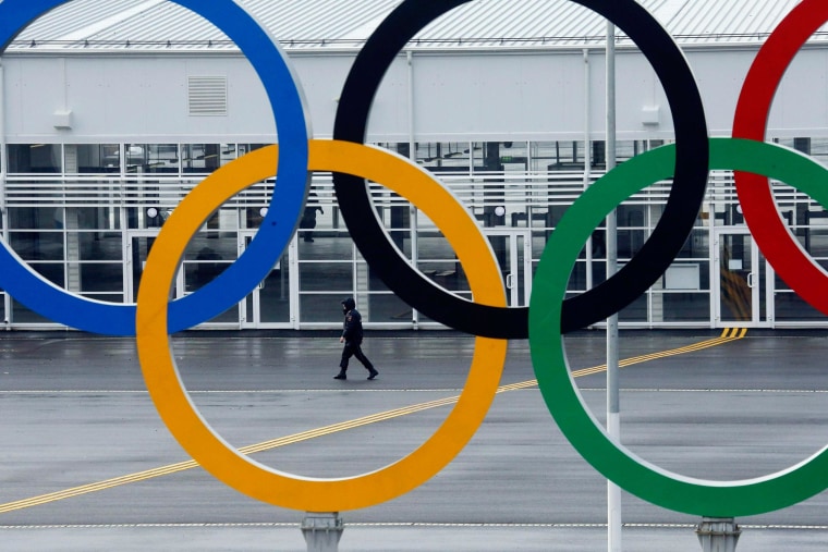 Image: A police officer walks at the Olympic Park in the Adler district of Sochi