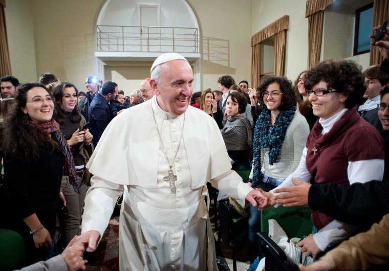 Image: Pope Francis is greeted during a pastoral visit at the Sacro Cuore Basilica in downtown Rome