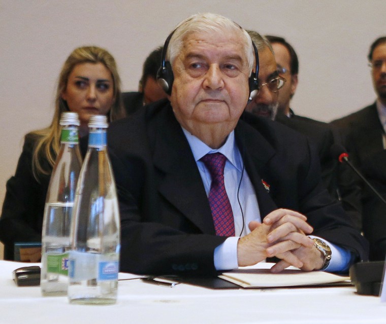 Image: Syria's Foreign Minister Walid al-Moallem looks on at the start of peace talks on Wednesday in Montreux, Switzerland.