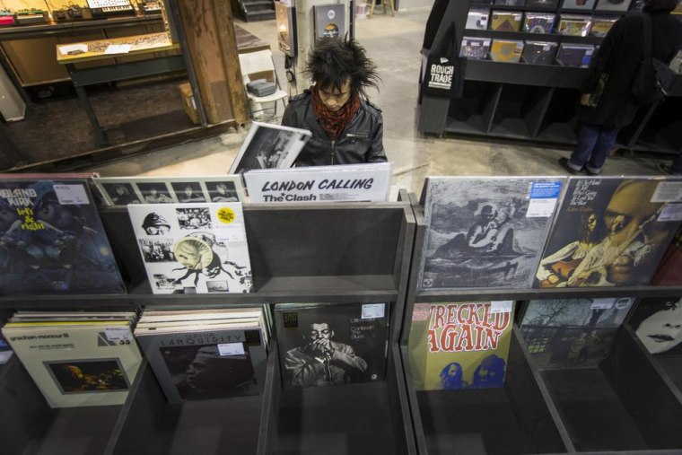 A man peruses albums displayed inside of the record store Rough Trade in the Williamsburg neighborhood of New York