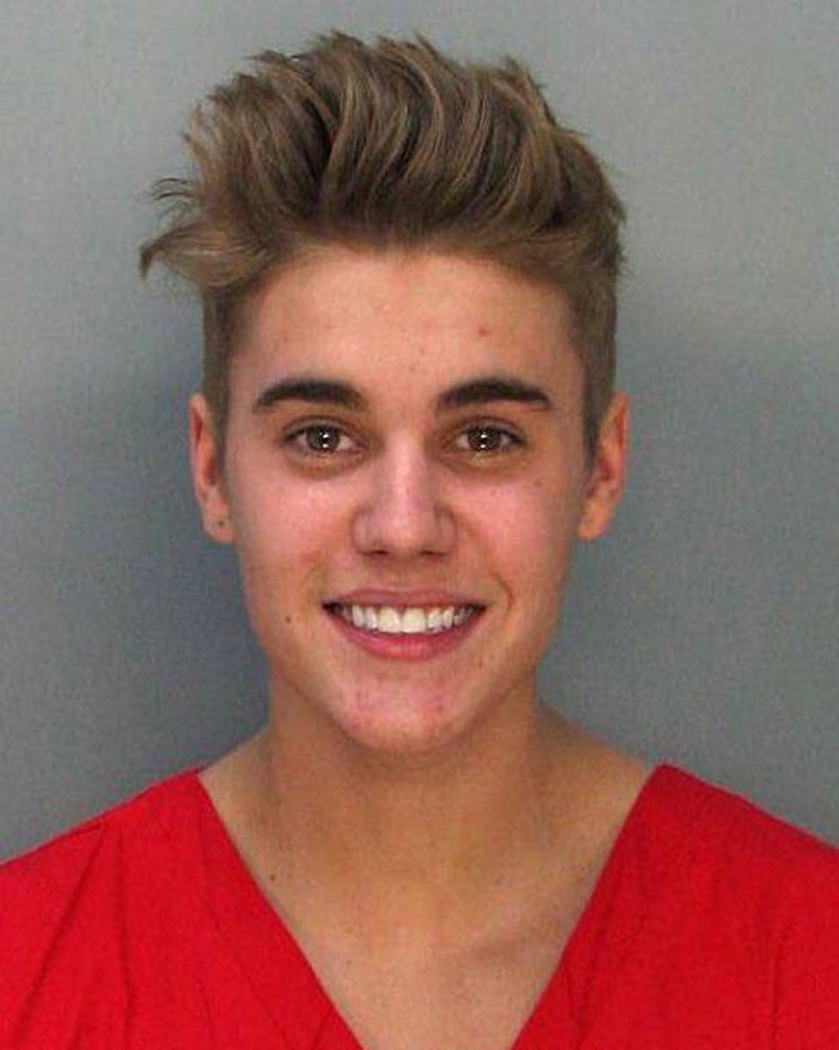  Pop star Justin Bieber poses for a booking photo at the Miami-Dade Police Department on Thursday.  
