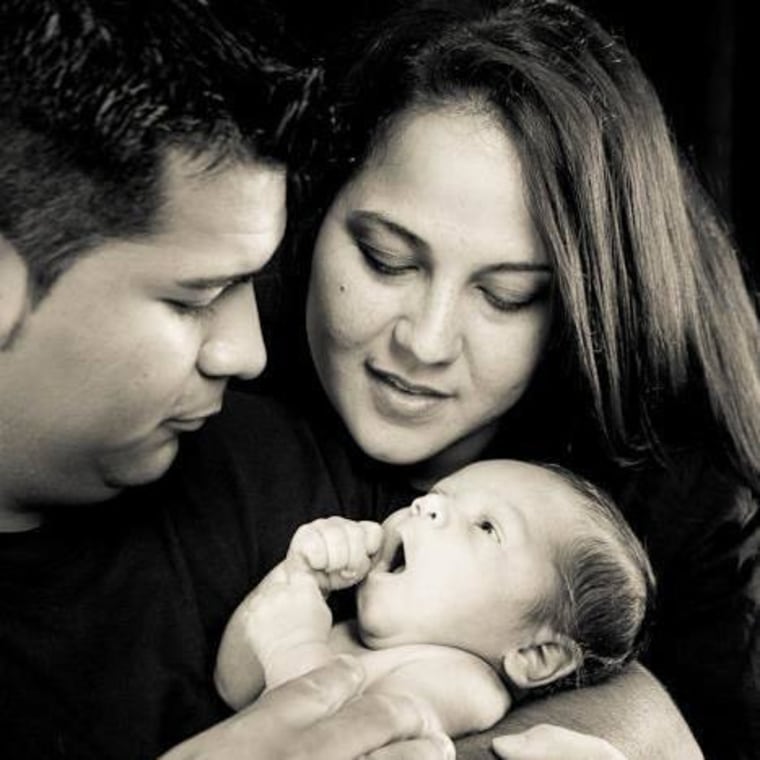 Image: Erick and Marlise Munoz hold their son Mateo