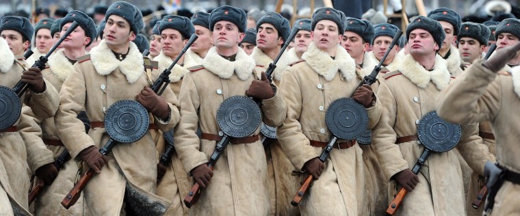 Wearing WWII-era winter clothing of Red Army Russian soldiers march during a military parade to mark the 70th anniversary of the final raise of the Nazi blockade of the city Leningrad, now St. Petersburg, on January 27, 2014. The German and Finnish siege and blockade of Leningrad was broken on January 18, 1943 but finally lifted a year after, on January 27, 1944. The city's name was changed back from Leningrad to St. Petersburg after the 1991 Soviet collapse. 