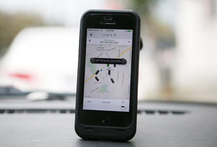 An Uber app is seen on an iPhone in Beverly Hills