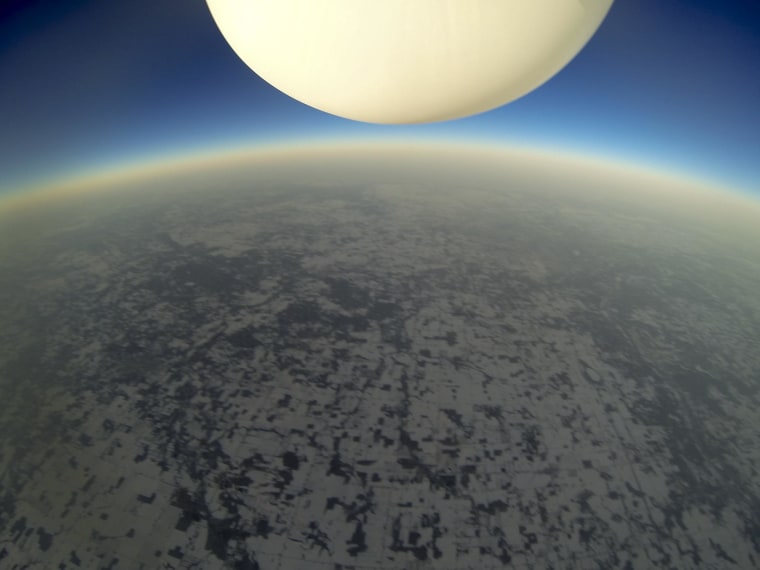 Image: Cameras captured the Grandville RoboDawgs' balloon floating through the Earth's atmosphere during a Dec. 28, 2013  launch.