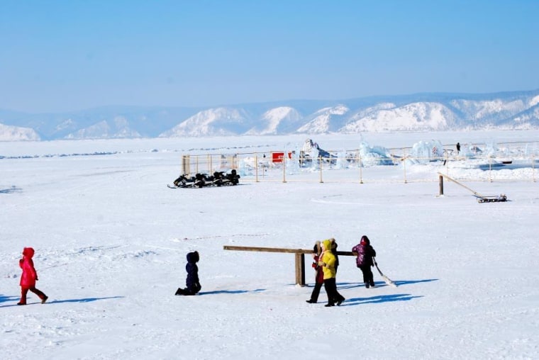 Visitors enjoy a frozen Lake Baikal during the winter time.