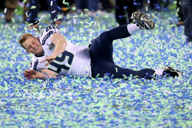 EAST RUTHERFORD, NJ - FEBRUARY 02:  Long snapper Clint Gresham #49 of the Seattle Seahawks celebrates their 43-8 victory over the Denver Broncos to win Super Bowl XLVIII at MetLife Stadium on February 2, 2014 in East Rutherford, New Jersey.  (Photo by Stephen Dunn/Getty Images)