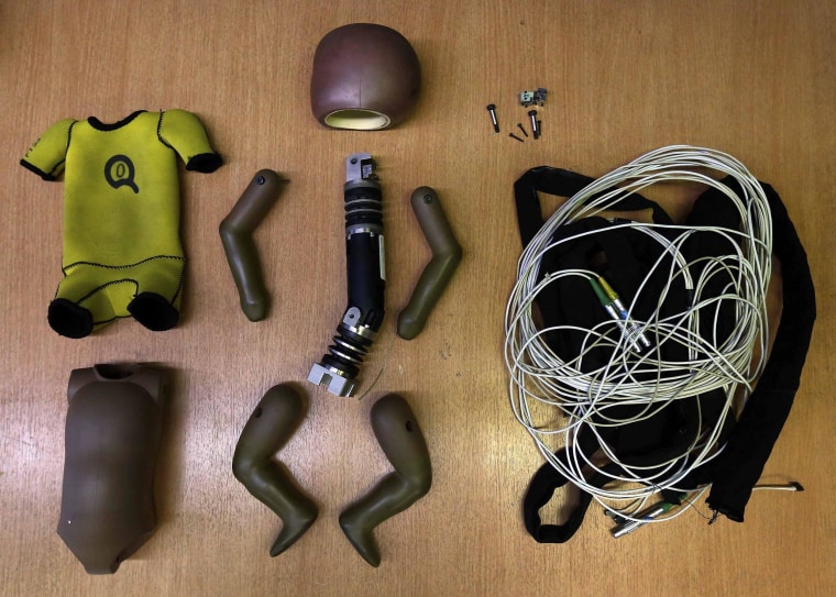 Image: A dummy is prepared for a car crash-test at the laboratory of the German motor club ADAC in Landsberg