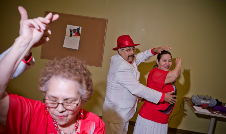 Image: Consuelo Martinez, left,  Eloy Guerrero, center, and Gloria Barrios, members of the group Los Danzonera Pilsen, perform at Casa Maravilla in Chicago.