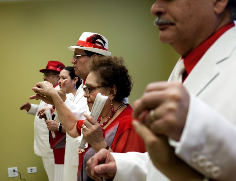 Image: Los Danzonera Pilsen, a group of senior citizens  who dance traditional 1940's style Cuban dancing, perform at Casa Maravilla in Chicago.
