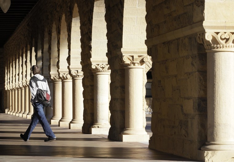 A Stanford University student walks though the halls of the Stanford University campus in Palo Alto, Calif., Wednesday, Feb. 15, 2012. The latest annual college fundraising figures out Wednesday show donations to colleges and universities rose 8.2 percent in fiscal 2011, crossing back over the $30 billion mark for just the second time ever, and improving many schools' financial footing after several lean years due to the economic downturn. Stanford University, which recently broke an all-time record by completing a 5-year, $6.2 billion fundraising campaign, led with $709.4 million collected in fiscal 2011. (AP Photo/Paul Sakuma)