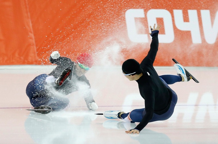 Image: Kim Jun Ho of South Korea crashes during practice at the Adler Arena in preparation for the 2014 Sochi Winter Olympics