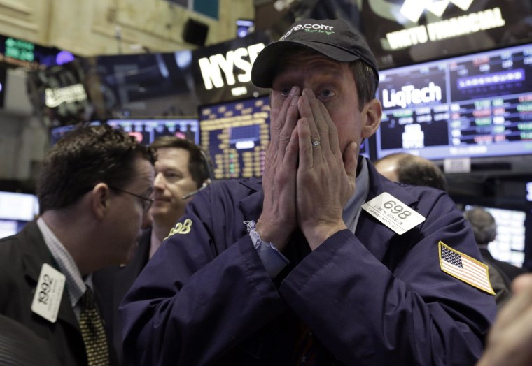 Trader Luke Scanlon works on the floor of the New York Stock Exchange on Wednesday. Stocks edged lower in early trading.
