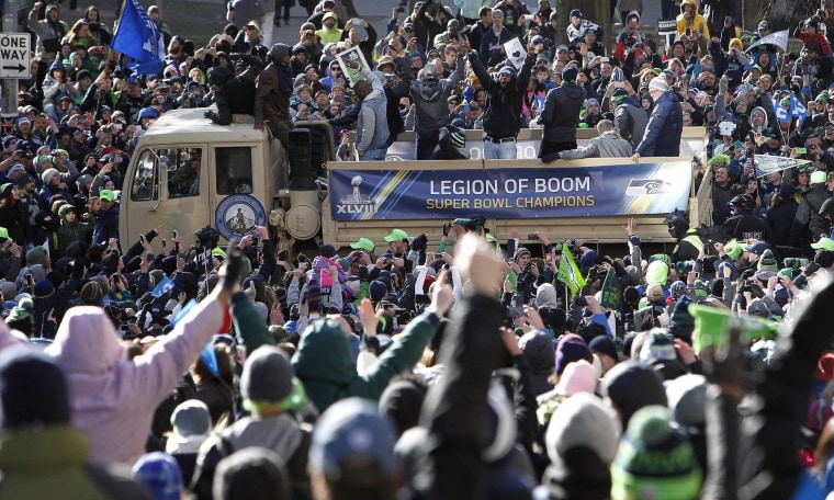 Image: Seahawks' Sherman celebrates with fans during the NFL team's Super Bowl victory parade in Seattle