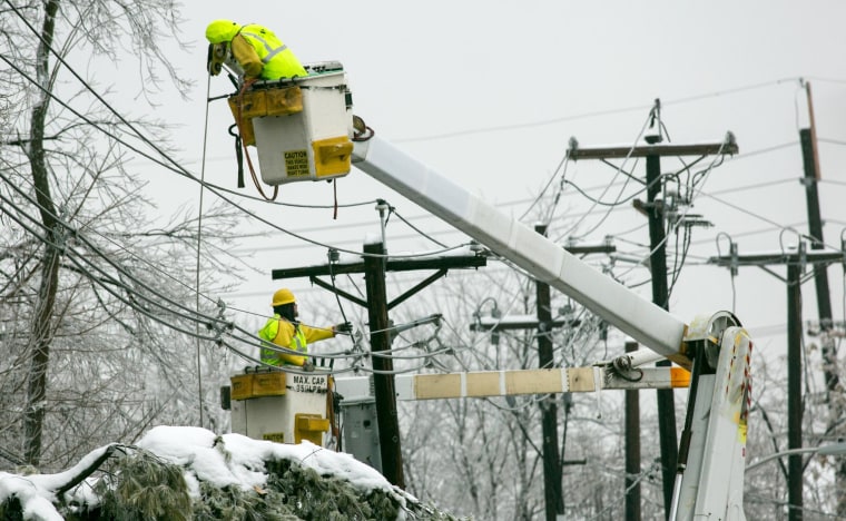 Image: PSE&G linemen work in East Brunswick, N.J. to restore power to tens of thousands of customers who lost service after ice coated trees and transmission lines on Feb. 5.