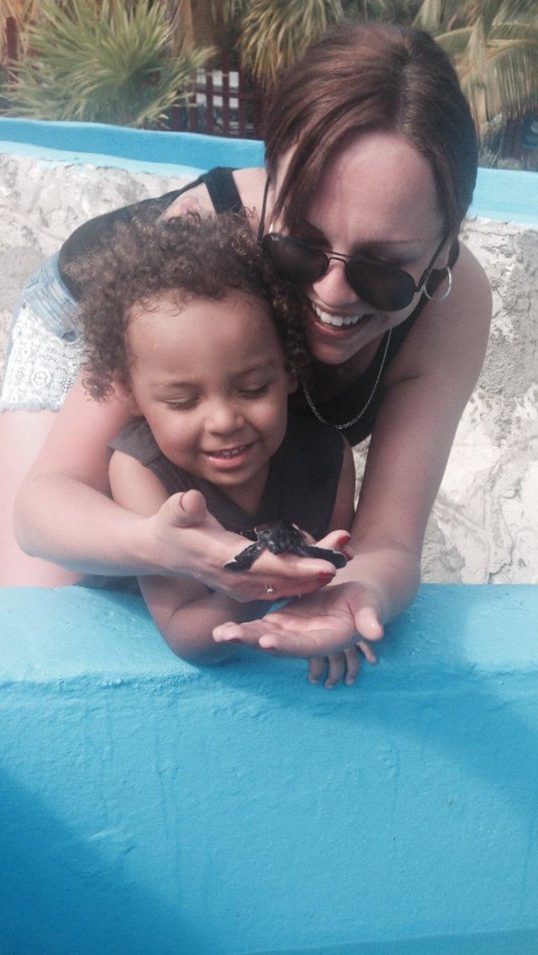 Justine Davis with her son, Cameron, visiting a turtle farm in Cuba on Dec. 23, 2013, just hours before the scooter accident that claimed his life.