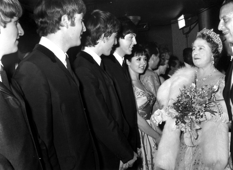 Image: Queen Elizabeth The Queen Mother (1900 - 2002) talking to British pop group The Beatles