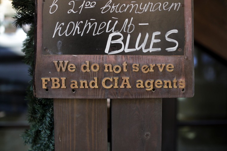 Image: A sign that says \"We do not serve FBI and CIA agents,\" hangs outside a restaurant