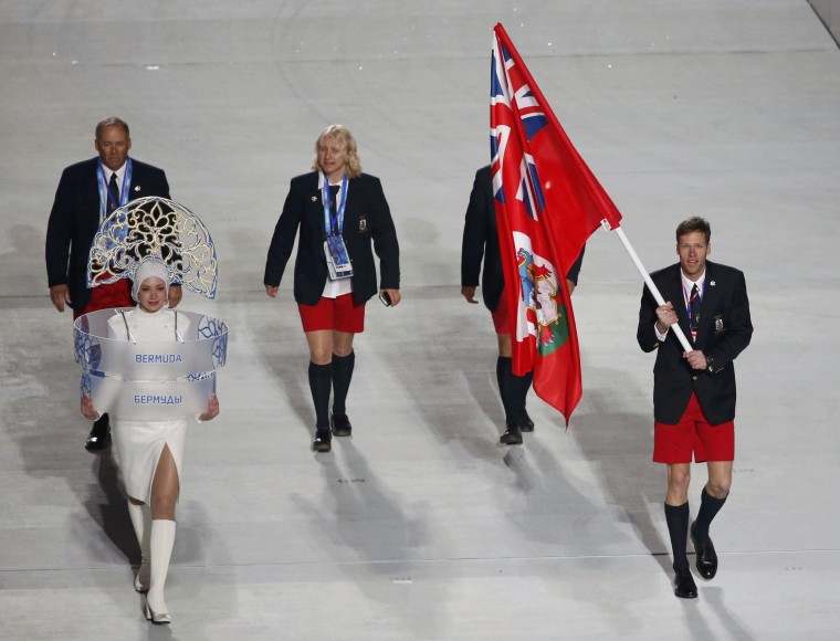 Bermuda's flag-bearer Tucker Murphy leads his country's contingent during the opening ceremony of the 2014 Sochi Winter Olympics, February 7, 2014. REUTERS/Lucy Nicholson (RUSSIA  - Tags: OLYMPICS SPORT)  