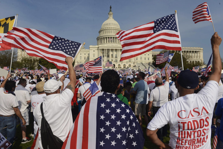 Image: People show their support during a rally for comprehensive immigration reform on the West Front of the US Capitol