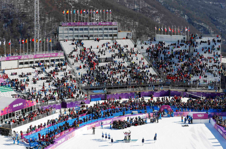 Image: Empty seats are seen in the spectator stands during the men's snowboard slopestyle final at the 2014 Sochi Olympic Games in Rosa Khutor