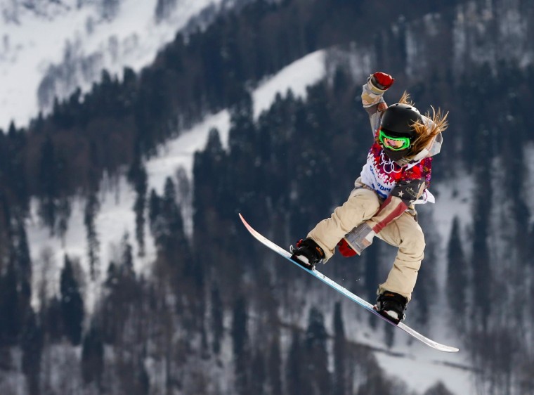 Winner Jamie Anderson of the U.S. jumps during the women's snowboard slopestyle finals event at the 2014 Sochi Winter Olympics in Rosa Khutor, February 9, 2014.