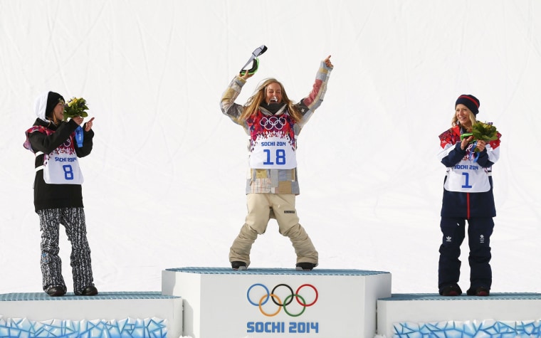Image: Second placed Finland's Rukajarvi, winner Anderson of the U.S. and third placed Britain's Jones celebrate during a flower ceremony after the women's snowboard slopestyle finals at the 2014 Sochi Winter Olympics in Rosa Khutor