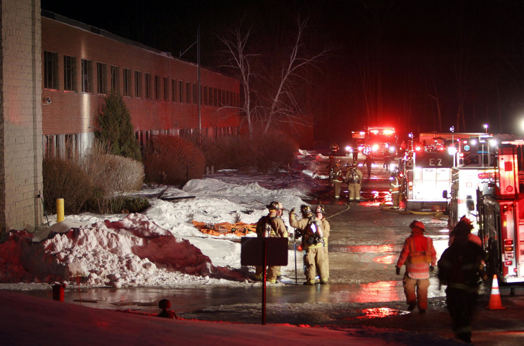 Image: Emergency crews from several towns work an area outside the New Hampshire Ball Bearing plant after an explosion in Peterborough, N.H.