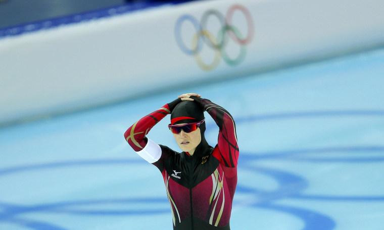 Image: Judith Hesse of Germany reacts after being disqualified for a second false start in race one of the women's 500 meters speed skating event during the 2014 Sochi Winter Olympics