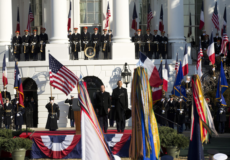 President Barack Obama and French President François Hollande stand for the national anthem during a state arrival ceremony on the South Lawn of the White House in Washington, Tuesday, Feb. 11, 2014. Overshadowed by the intrigue of a European love triangle and a glamorous White House gala, Tuesday's policy talks between President Barack Obama and French President Francois Hollande will showcase a revamped relationship that is now a cornerstone of diplomatic efforts in Iran and Syria, as well as the fight against extremism in northern Africa. 